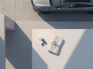 Elektrische auto op betonnen oprit met autosleutels en lease documenten op witte ondergrond, geometrische schaduwen